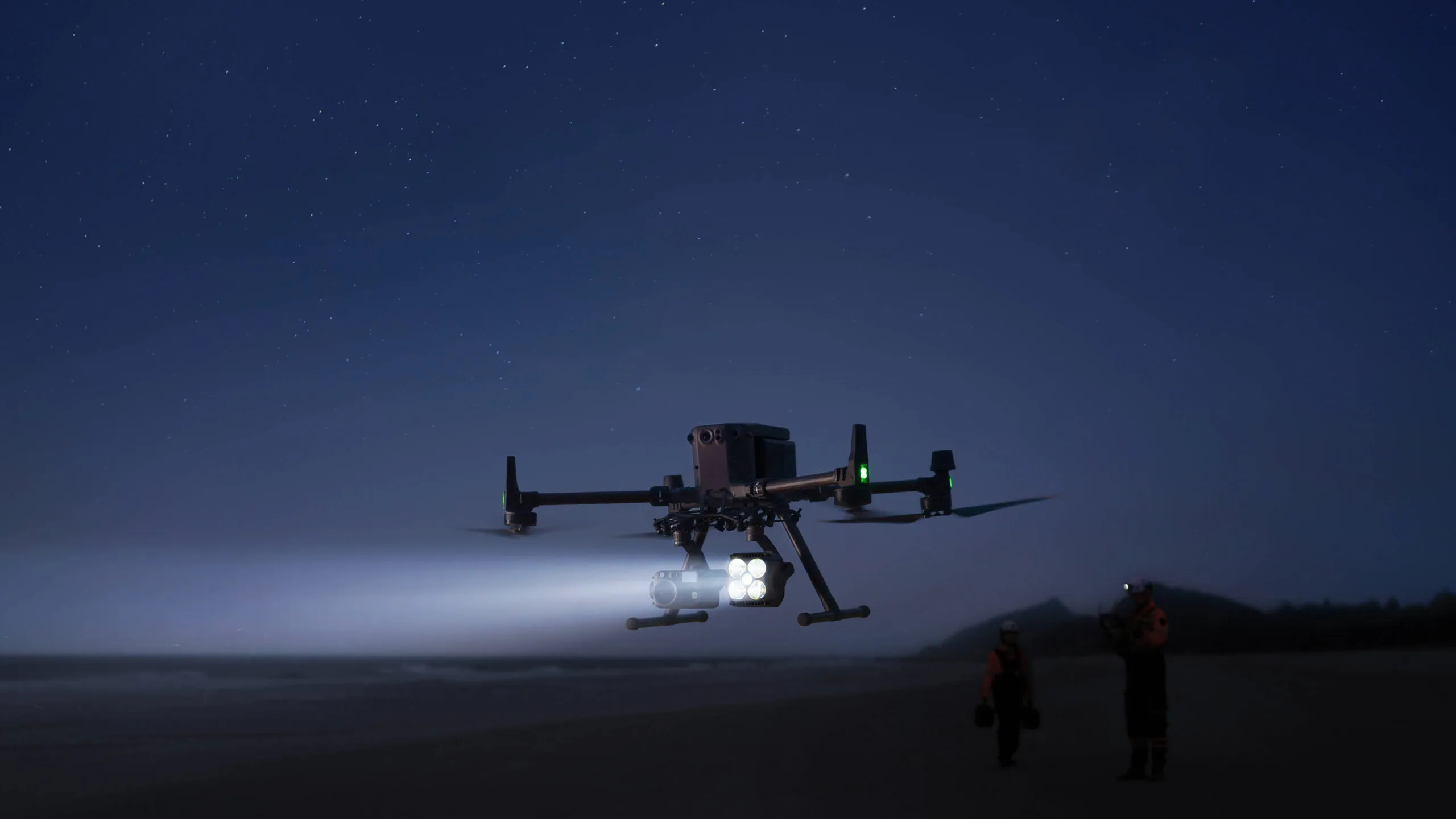DJI Matrice 400 lighting the ground with the Zenmuse S1 spotlight at night