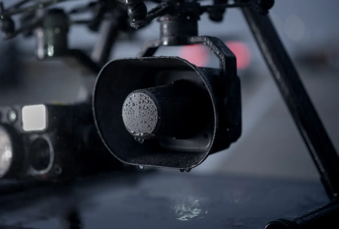 Close-up of the DJI Zenmuse V1 speaker on its gimbal