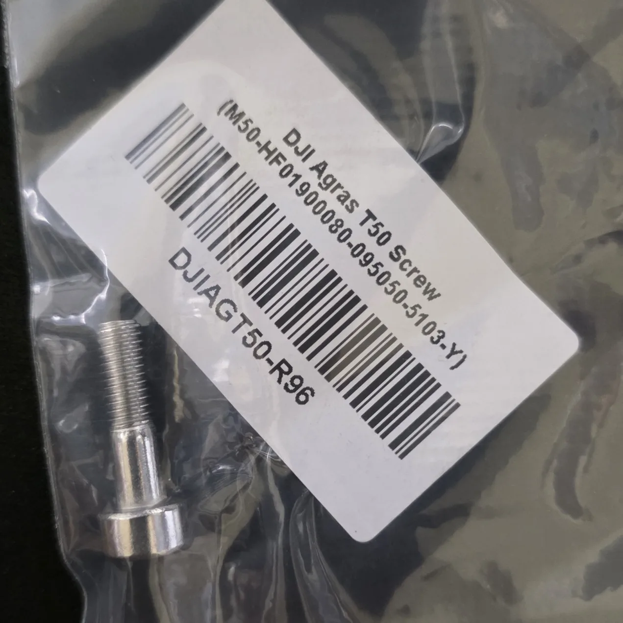 DJI Agras T50 Screw M50-HF01900080-095050-5103-Y in its supplier bag with the DJIAGT50-R96 label